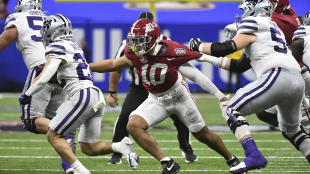 Dec 31, 2022; New Orleans, LA, USA; Kansas State running back Deuce Vaughn (22) runs the ball while Alabama linebacker Henry To'o To'o (10) closes to make a tackle during the 2022 Sugar Bowl at Caesars Superdome. Mandatory Credit: Gary Cosby Jr.-USA TODAY Sports